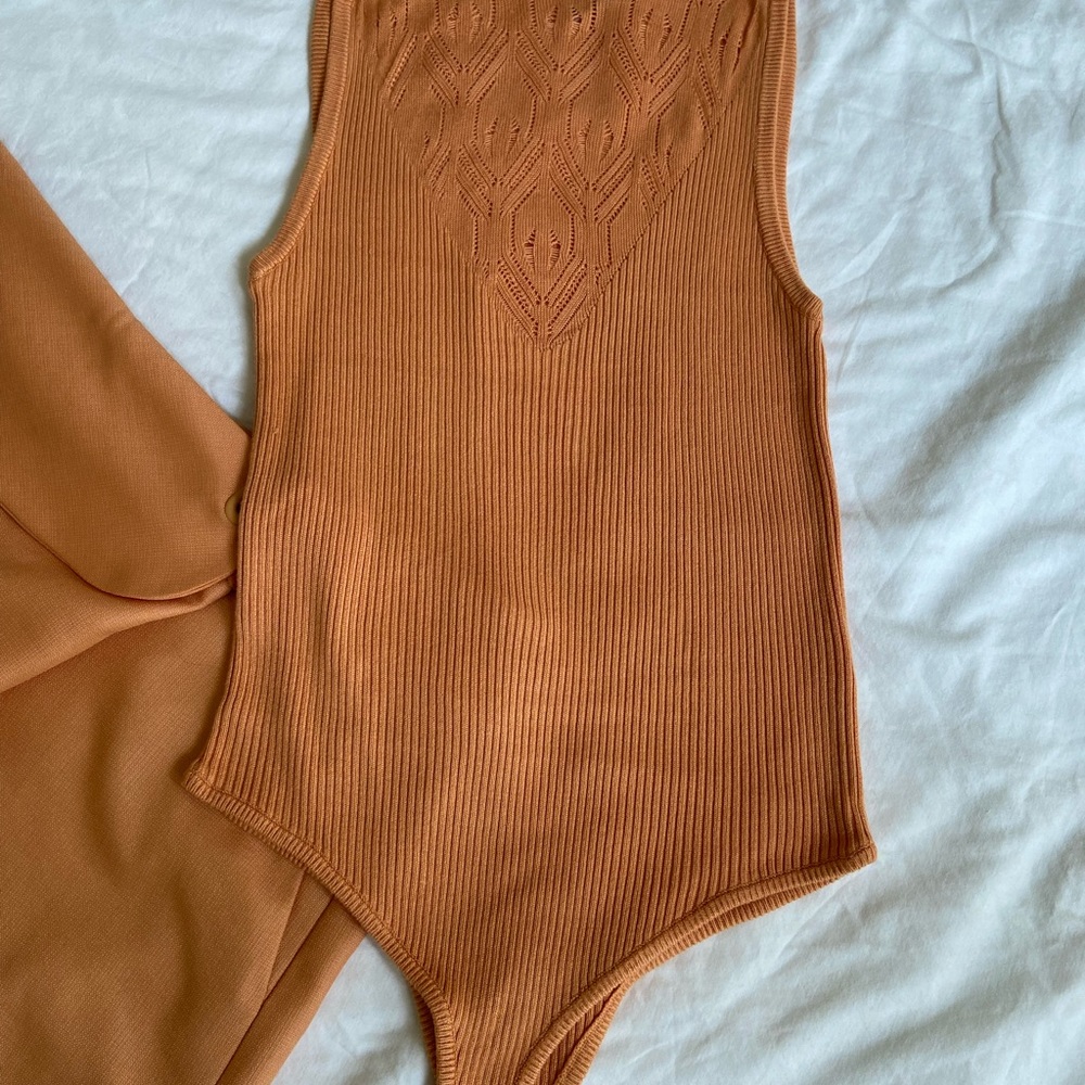 Shorts and body suit top.  Price is for both items